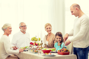 smiling family having holiday dinner at home