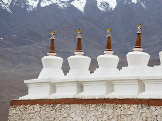 Buddhist stupa and Himalayas mountains . Shey Palace in Ladakh, India