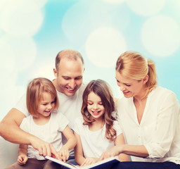 happy family with book at home