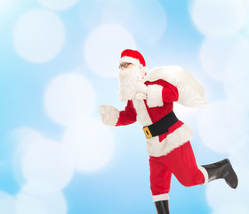 man in costume of santa claus with bag
