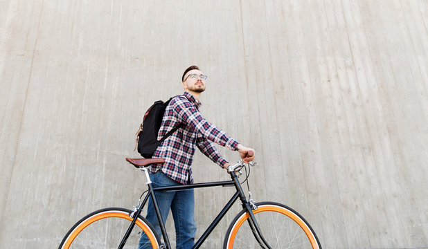 hipster man with fixed gear bike and backpack