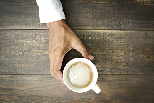 Man holding  cup of coffee