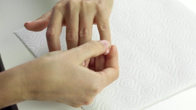 Professional nails care in process - dehydration of female nail after gel polish application procedure