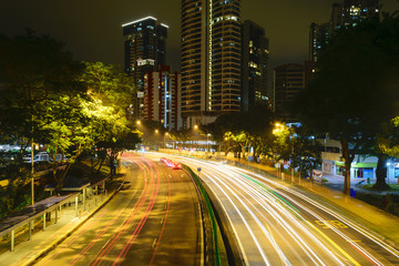 Car lights at night in Singapore.