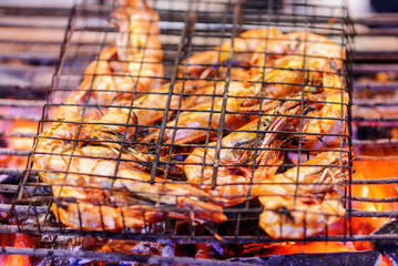 Grilled prawns on flaming in thai seafood restaurant