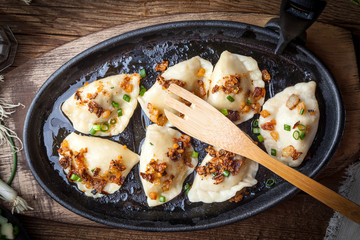 Dumplings with meat, onion and bacon.