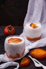 The homemade yogurt in a glass of persimmon