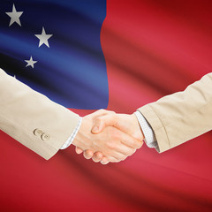 Businessmen handshake with flag on background - Samoa