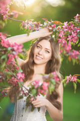 Fototapeta premium Young spring fashion woman in spring garden Springtime Summertim
