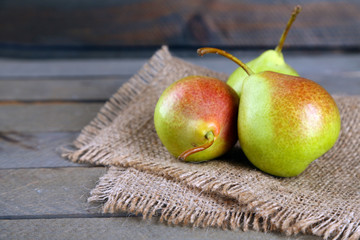 Ripe tasty pears on table close up