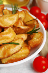 Baked potato wedges on table, closeup
