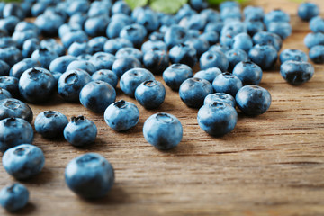 Fresh blueberries on wooden table, closeup