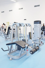 Fototapeta na wymiar Interior of a fitness hall with fitness equipment