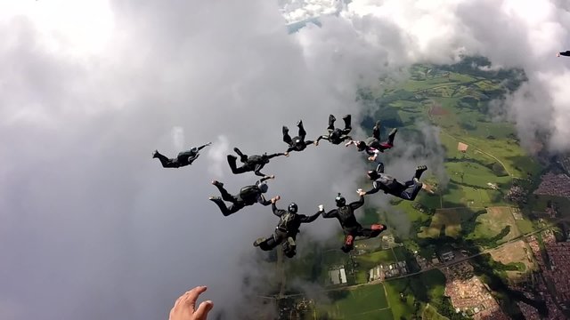 Skydiving group team work make a star