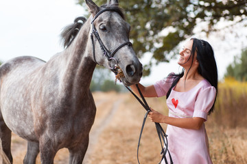 Fototapeta premium Young woman with a horse