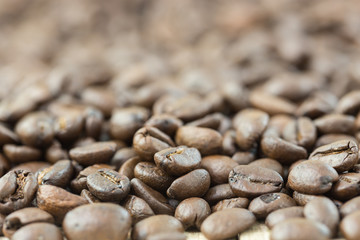 coffee beans in sack bag on wooden background