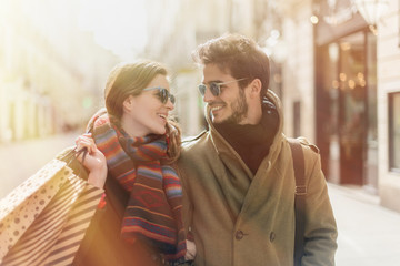 stylish young couple doing shopping in the street