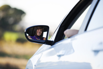 .Woman driving her new car