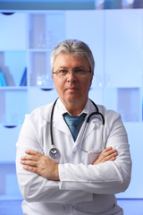 Doctor with stethoscope at his workplace