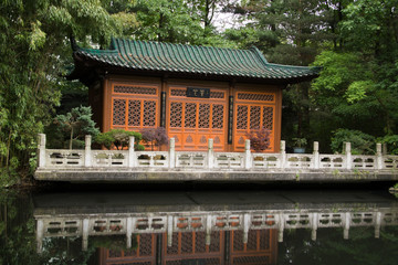 Pond with reflections of a Chinese pavilion