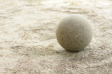 Fototapeta na wymiar Old soccer ball on the sand