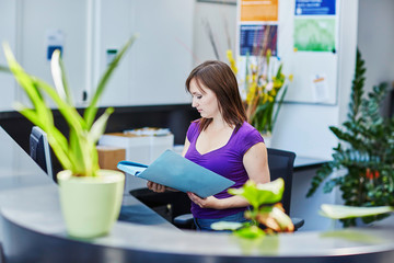 beautiful young receptionist at work