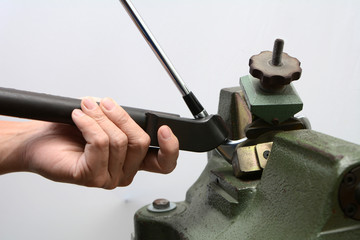 Club maker adjust loft and lie of golf club iron