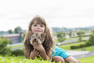 portrait of girl keeping pretty dog outdoor