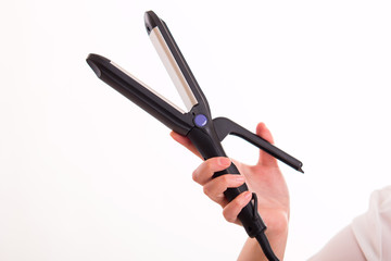 Hair straightener in hand