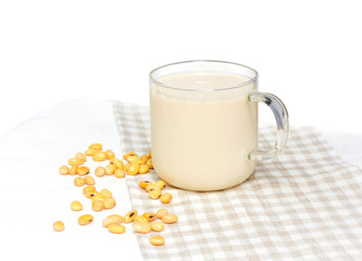 Soy milk with soy bean isolated on white background