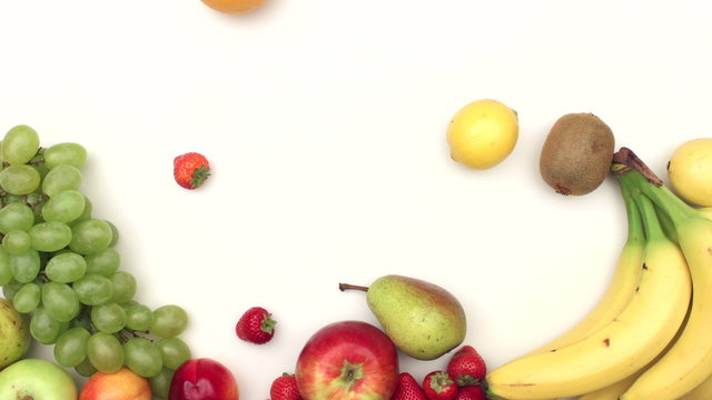 Fresh fruits moving on white background - stop motion animation
