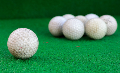 Golf ball on the glass and blur background.