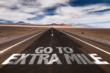 Go To Extra Mile written on desert road - obrazy, fototapety, plakaty