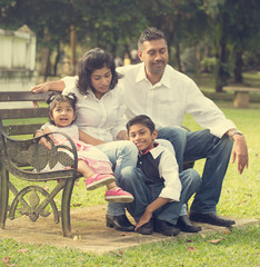 indian family enjoying quality time at outdoor park