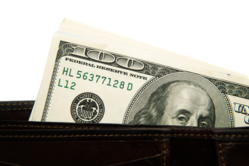 Old  wallet with banknotes of US dollars inside