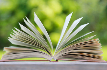 Open book on wooden table