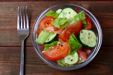 Fresh salad with tomatoes, cucumbers and lettuce