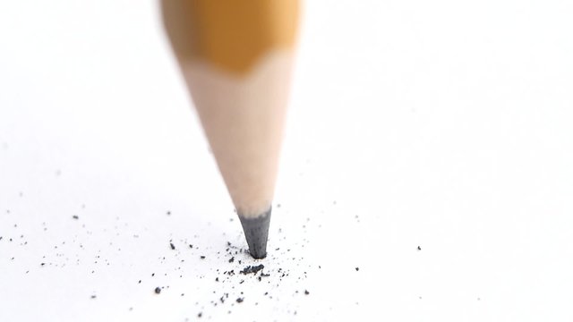 Broken head of sharp pencil on a white, slow motion