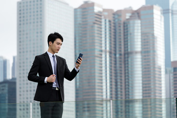 Businessman read the message on cellphone