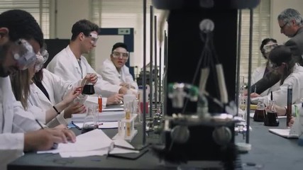 Students working on their science experiments - Powered by Adobe