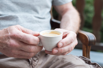 Man holding a cup of coffee