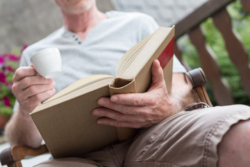 Man reading a book outdoor
