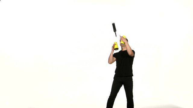 man bartender does a trick with a shaker  and bottle