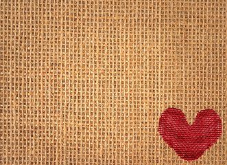 Red heart over linen texture background