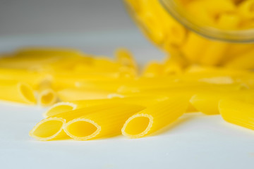 Italian Penne Rigate Macaroni Pasta, raw food, close up
