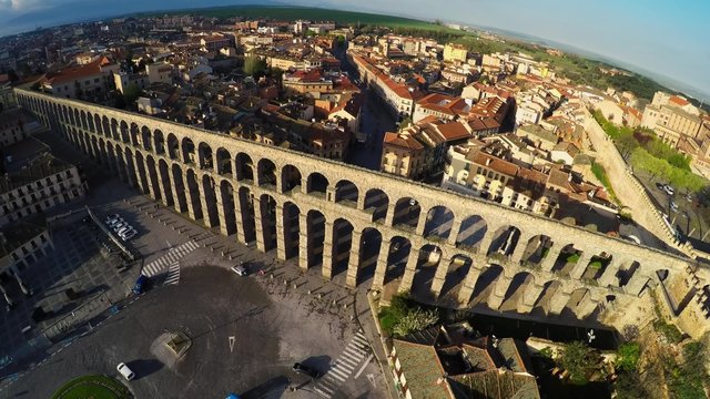 Aerial footage Segovia, Spain town skyline at the ancient Roman aqueduct. rotation zenith wide angle view aerial