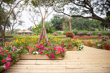 Fototapeta na wymiar Beautiful flower garden with bamboo path