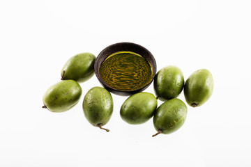 olive with oil in a wooden  bowl