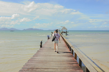 women walk on Wooden pier on summer season - Wooden pier in Kho