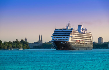 Big cruise ship entering the port of Bordeaux. - obrazy, fototapety, plakaty